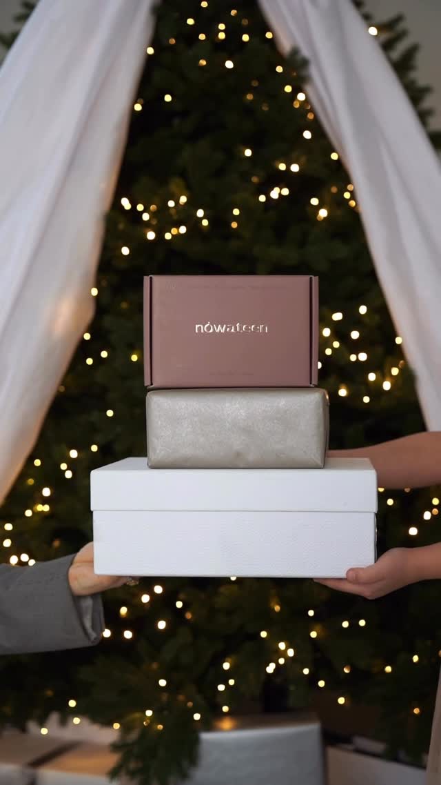 nowateen gift packaging stacked boxes in front of Christmas tree